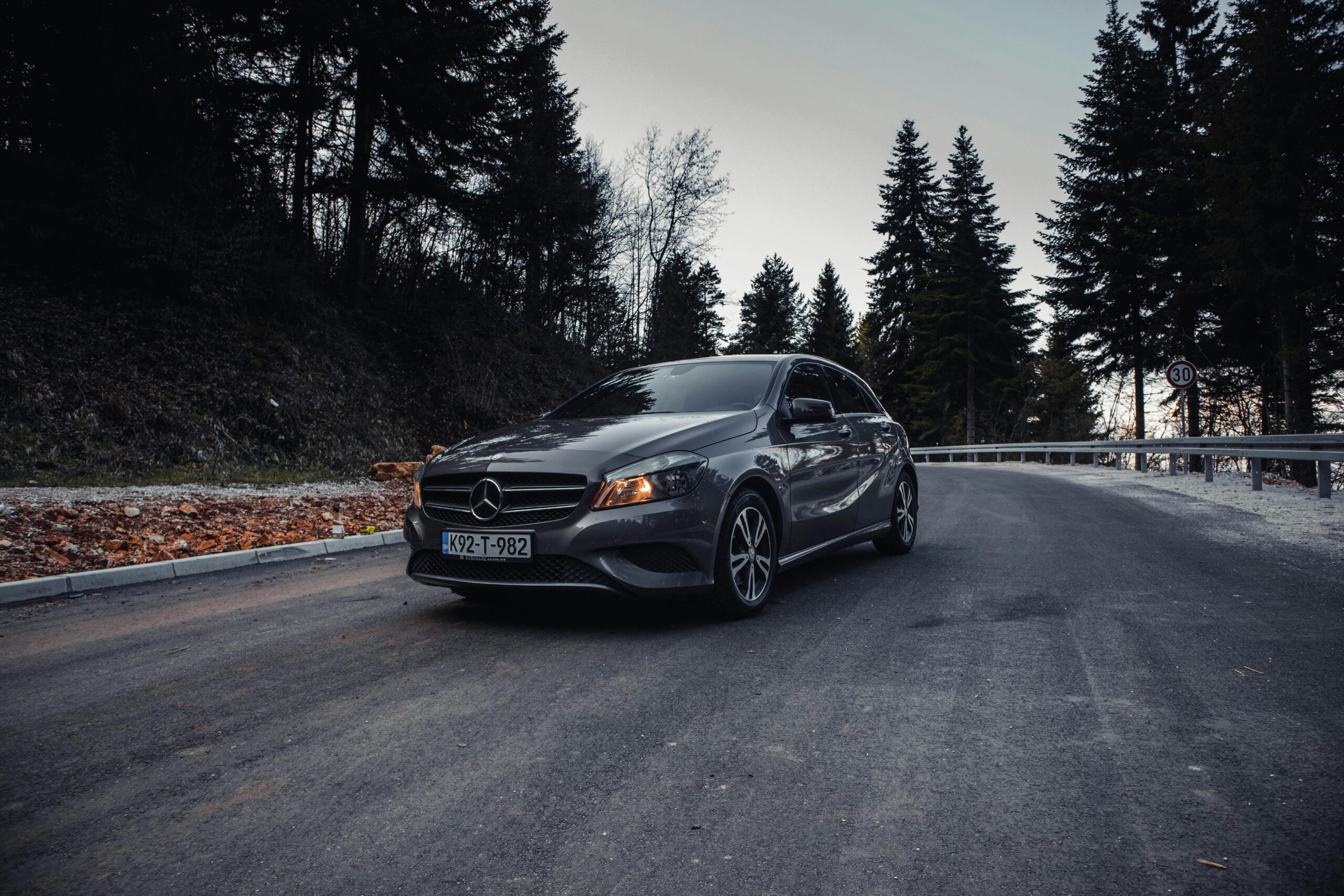 Cinematic shot of Mercedes-Benz on an asphalt road in Ilidža forest area.